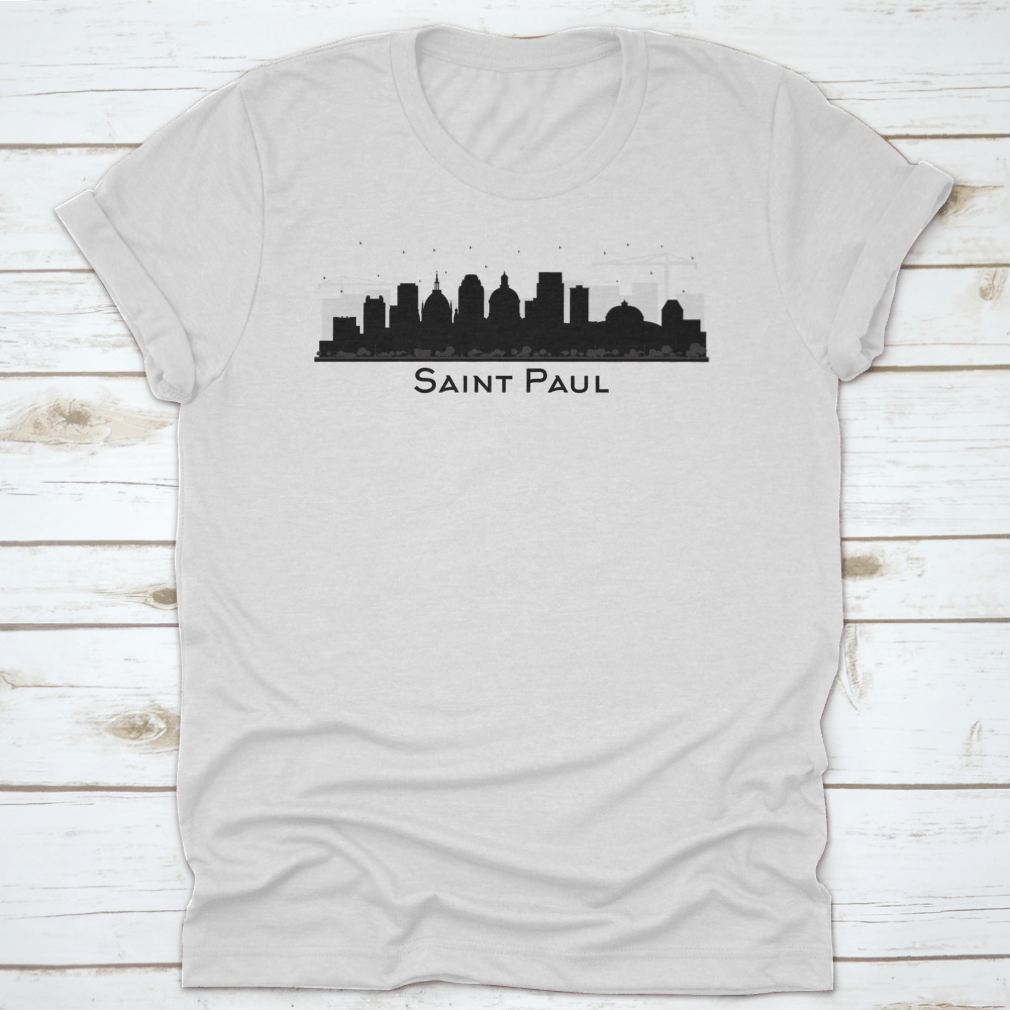 A stylish black t-shirt featuring the silhouette of the Saint Paul Minnesota city skyline, showcasing iconic buildings.