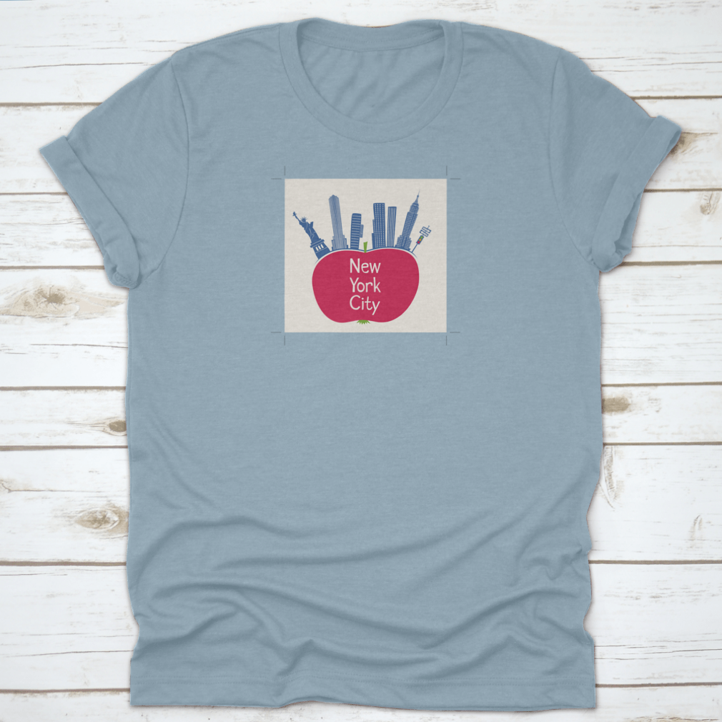 A stylish t-shirt featuring an apple design with the Statue of Liberty and the text 'New York City', showcasing a vibrant and unique NYC theme.