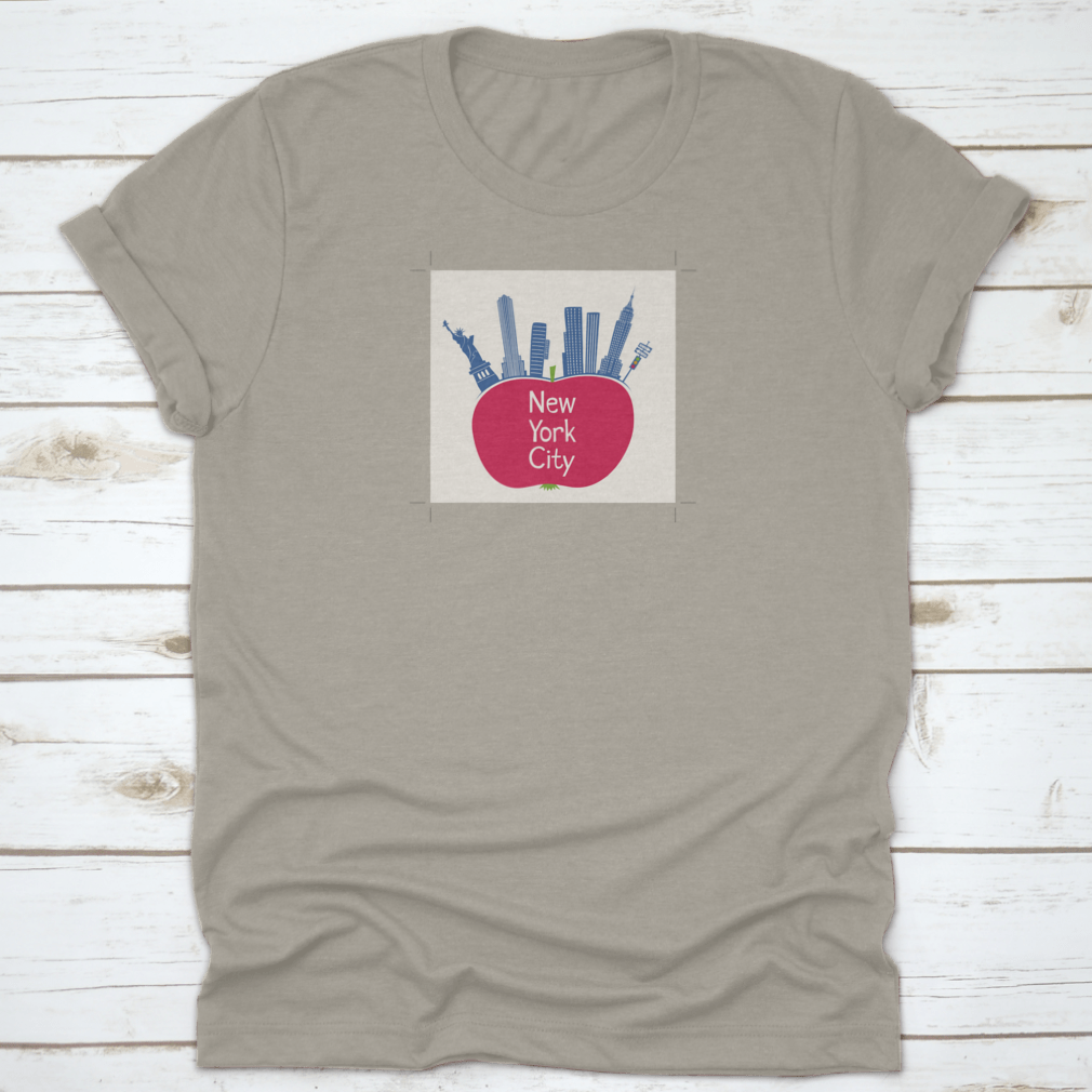 A stylish t-shirt featuring an apple design with the Statue of Liberty and the text 'New York City', showcasing a vibrant and unique NYC theme.