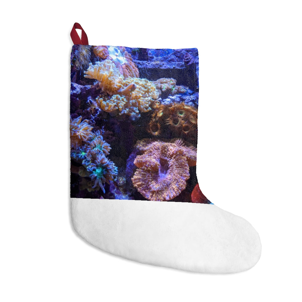 A colorful personalized Christmas stocking designed for aquariums, made of soft polyester fleece with a twill ribbon loop for hanging.