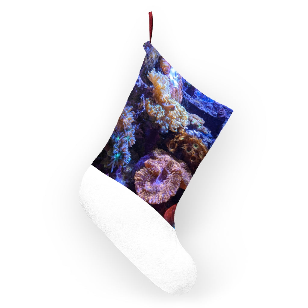 A colorful personalized Christmas stocking designed for aquariums, made of soft polyester fleece with a twill ribbon loop for hanging.