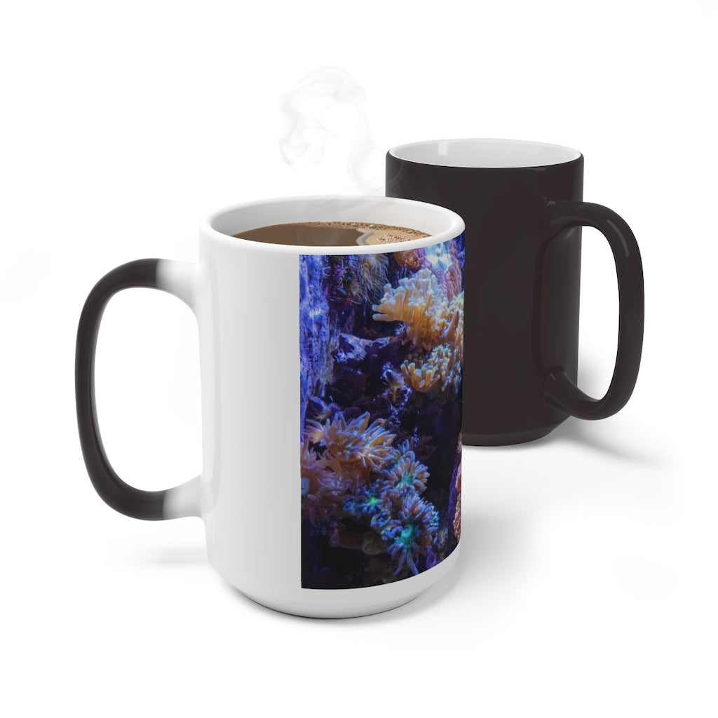 A white ceramic color changing mug displaying vibrant colors when filled with hot liquid, featuring a C-handle and rounded corners.