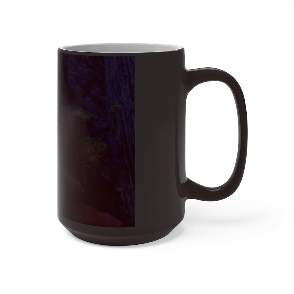 A white ceramic color changing mug displaying vibrant colors when filled with hot liquid, featuring a C-handle and rounded corners.