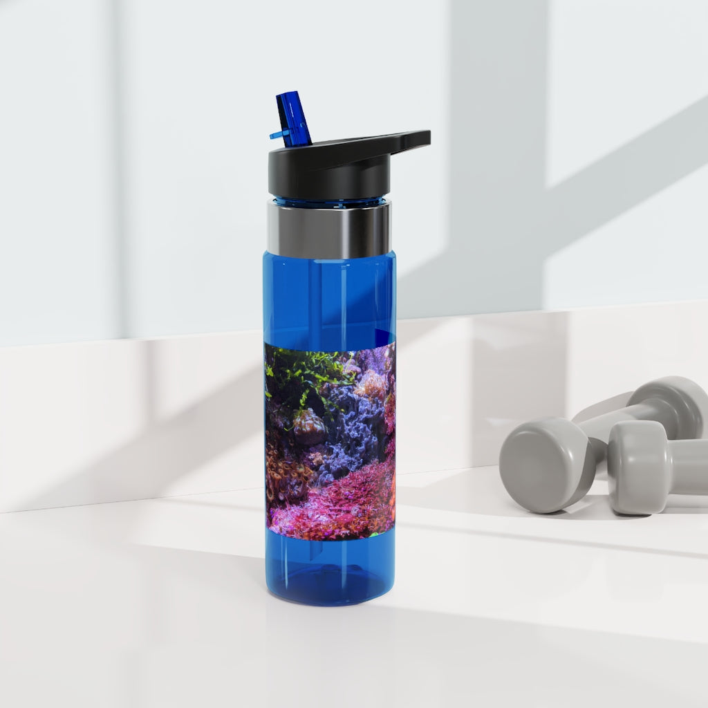 Aquarium Kensington Tritan™ Sport Bottle in vibrant colors with a carabiner hook and straw lid, showcasing its sleek design and 20oz capacity.