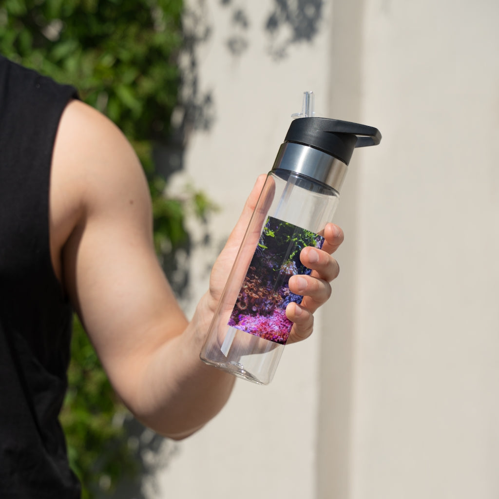 Aquarium Kensington Tritan™ Sport Bottle in vibrant colors with a carabiner hook and straw lid, showcasing its sleek design and 20oz capacity.