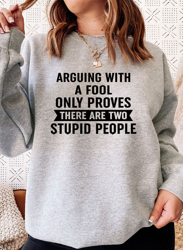 Arguing With A Fool Sweat Shirt featuring a cozy fleece lining and adjustable cuffs, designed for comfort and style.