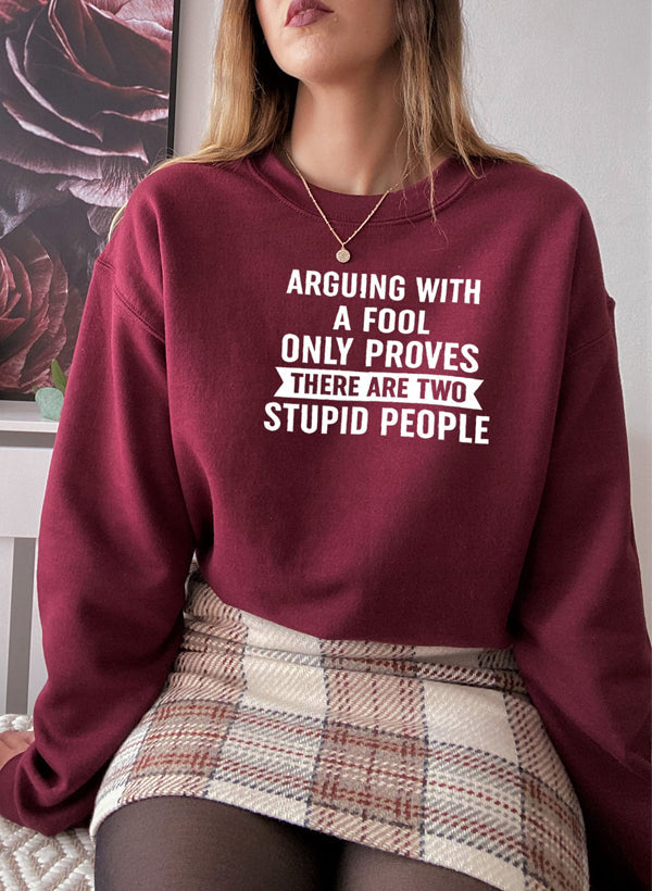 Arguing With A Fool Sweat Shirt featuring a cozy fleece lining and adjustable cuffs, designed for comfort and style.