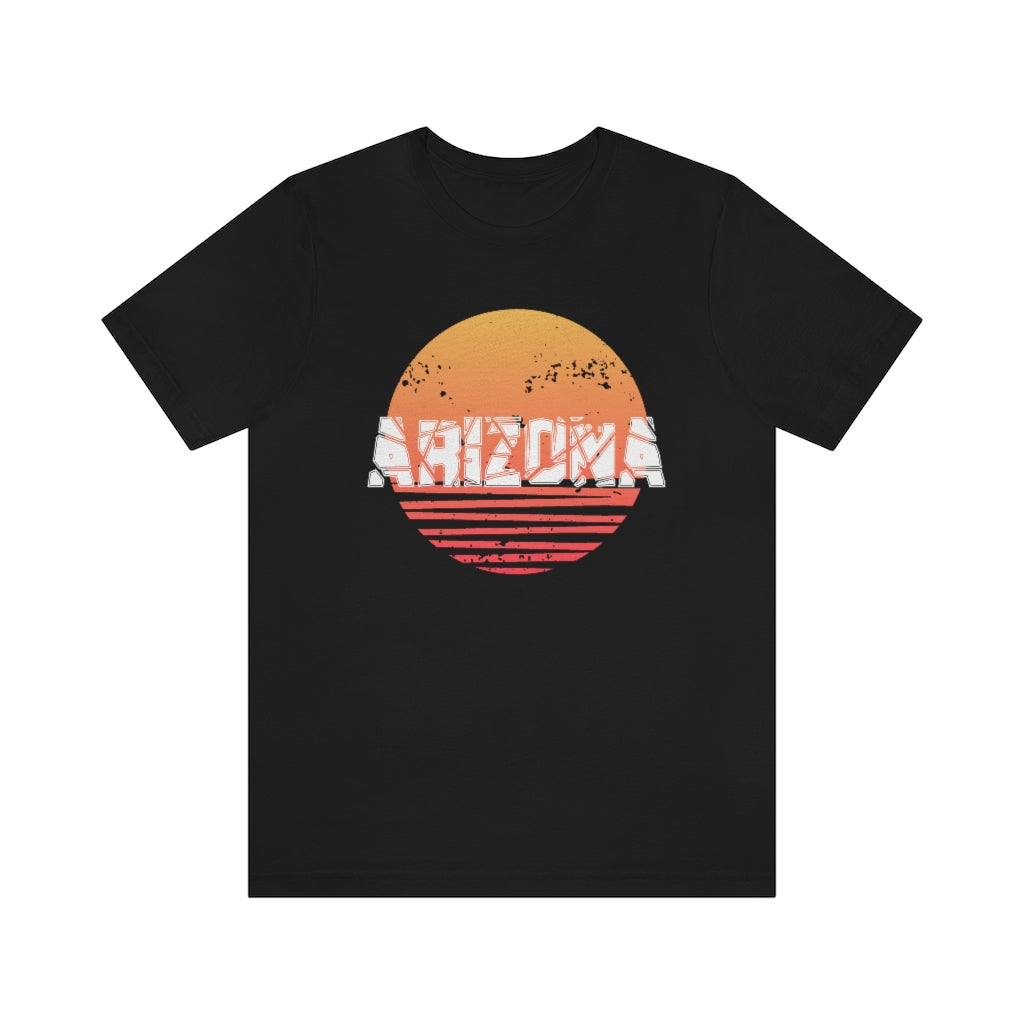 Arizona Sunset Souvenir T-Shirt featuring vibrant sunset design on soft cotton fabric, perfect for travel enthusiasts.