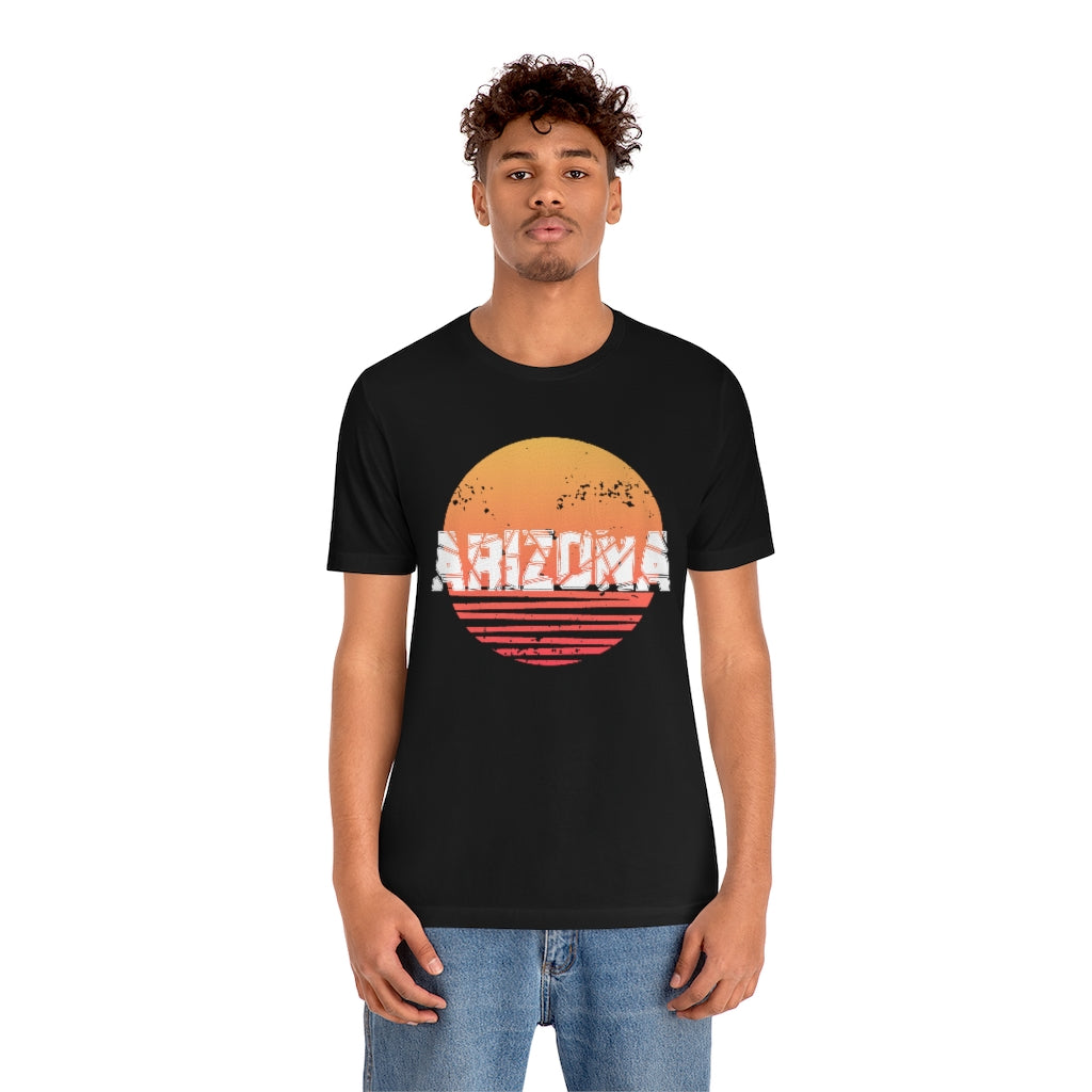 Arizona Sunset Souvenir T-Shirt featuring vibrant sunset design on soft cotton fabric, perfect for travel enthusiasts.