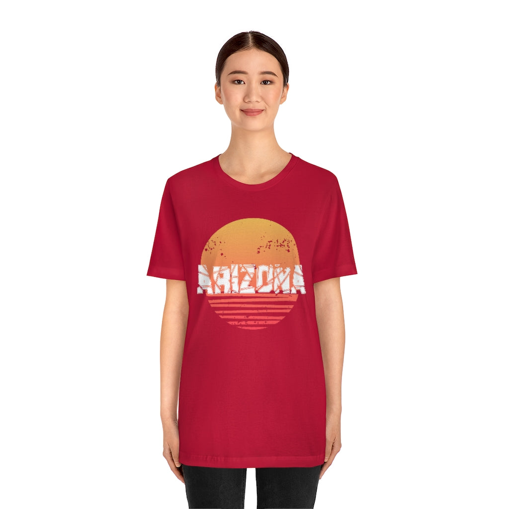 Arizona Sunset Souvenir T-Shirt featuring vibrant sunset design on soft cotton fabric, perfect for travel enthusiasts.