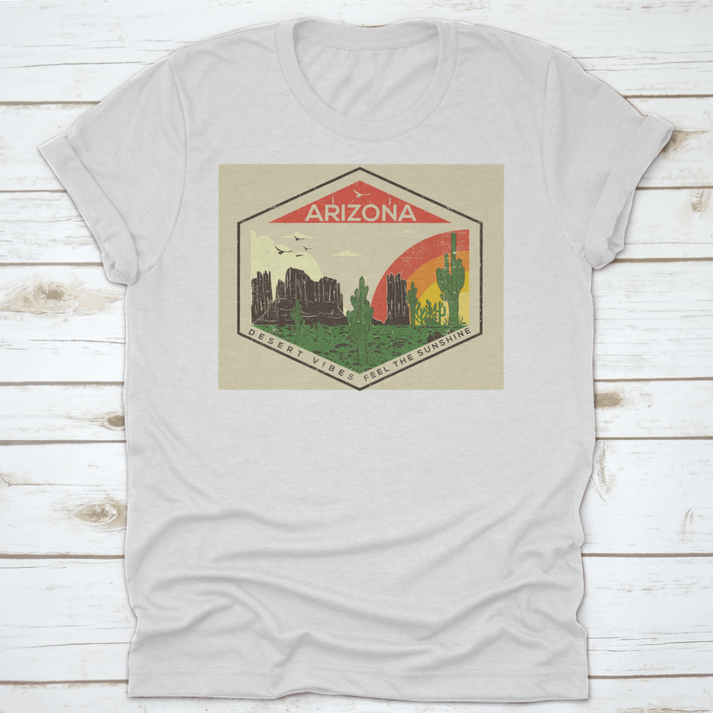 Arizona t-shirt featuring a rainbow, bird, and mountain rock views, showcasing a vibrant desert landscape.