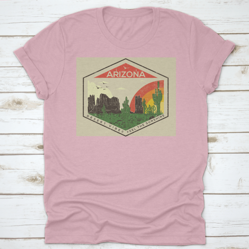 Arizona t-shirt featuring a rainbow, bird, and mountain rock views, showcasing a vibrant desert landscape.