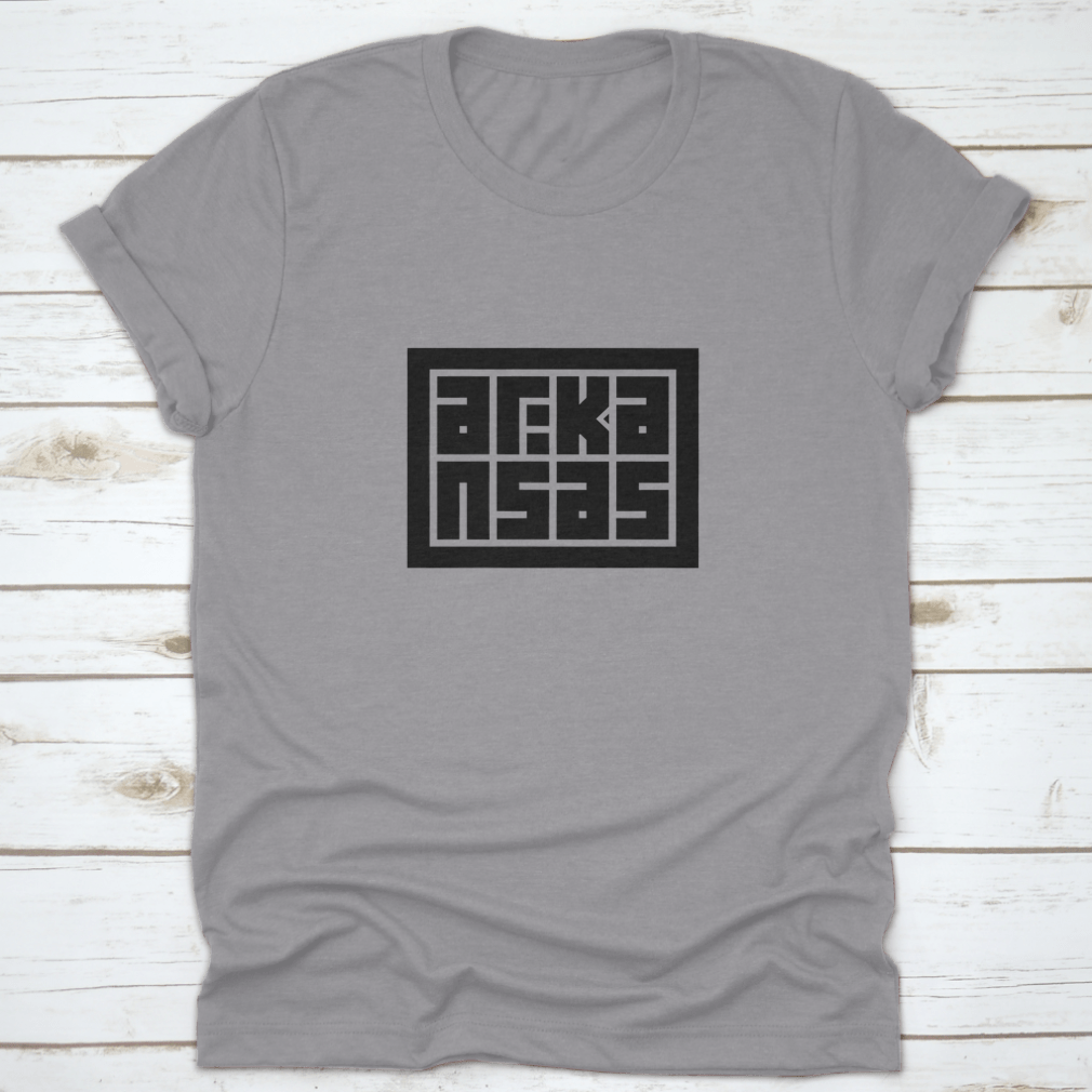 Arkansas Calligraphy Logo in decorative block code style typography on a cotton shirt, showcasing unique design and quality fabric.