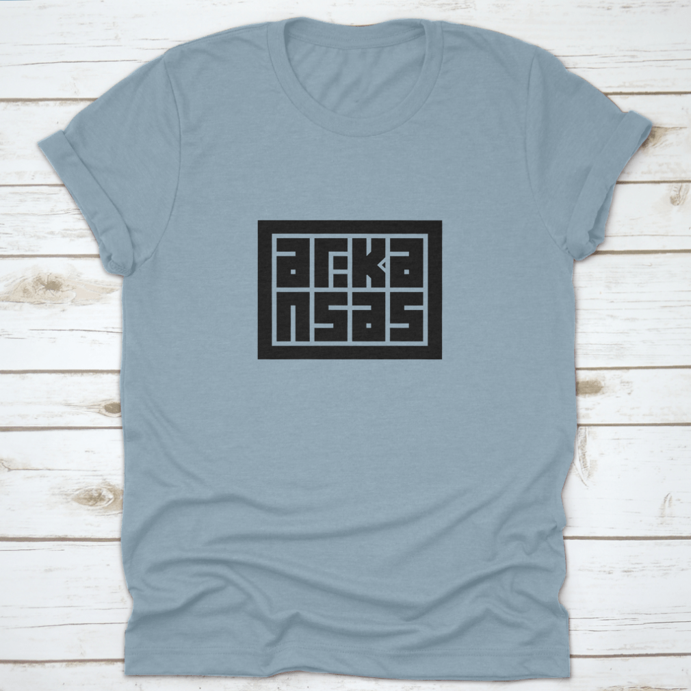 Arkansas Calligraphy Logo in decorative block code style typography on a cotton shirt, showcasing unique design and quality fabric.