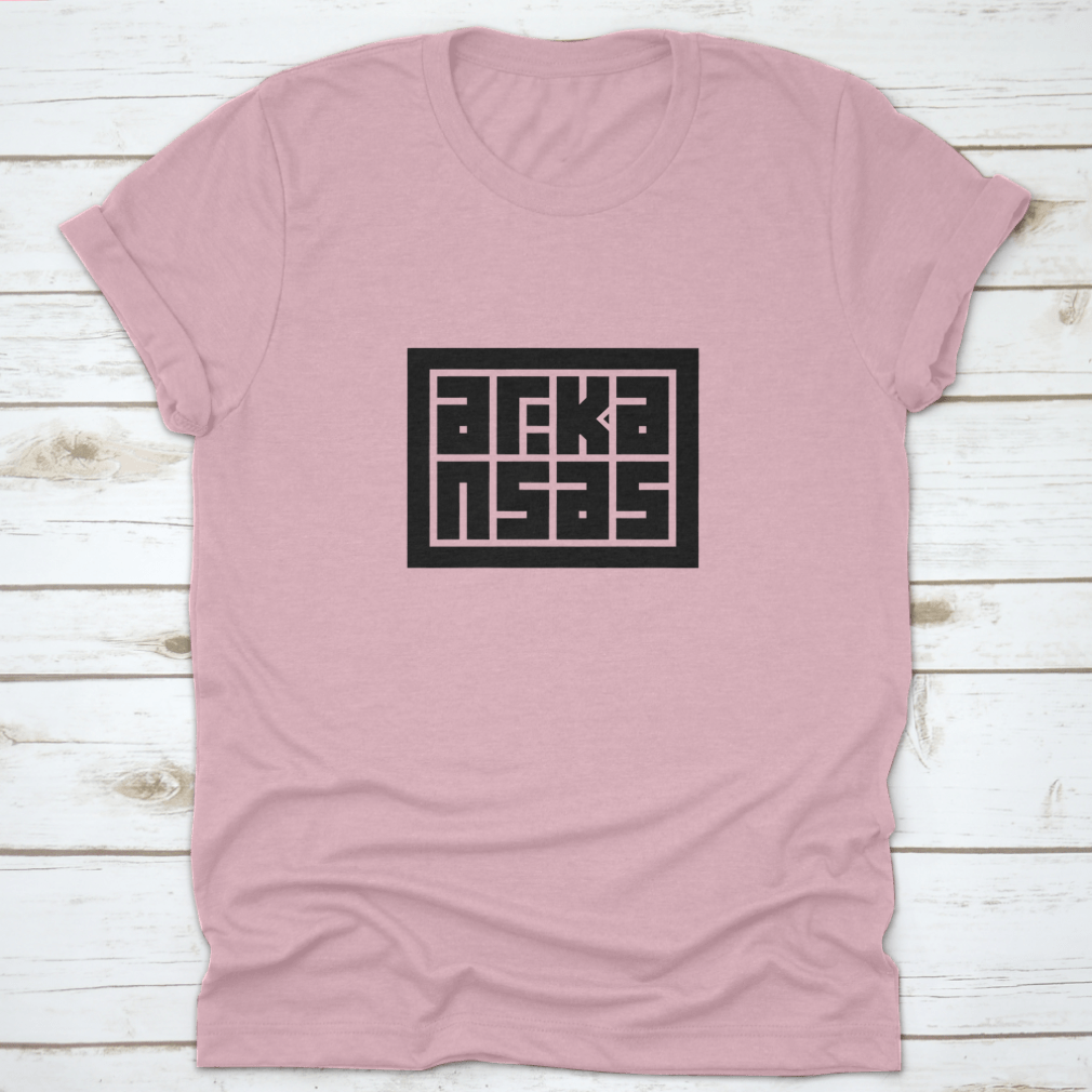 Arkansas Calligraphy Logo in decorative block code style typography on a cotton shirt, showcasing unique design and quality fabric.