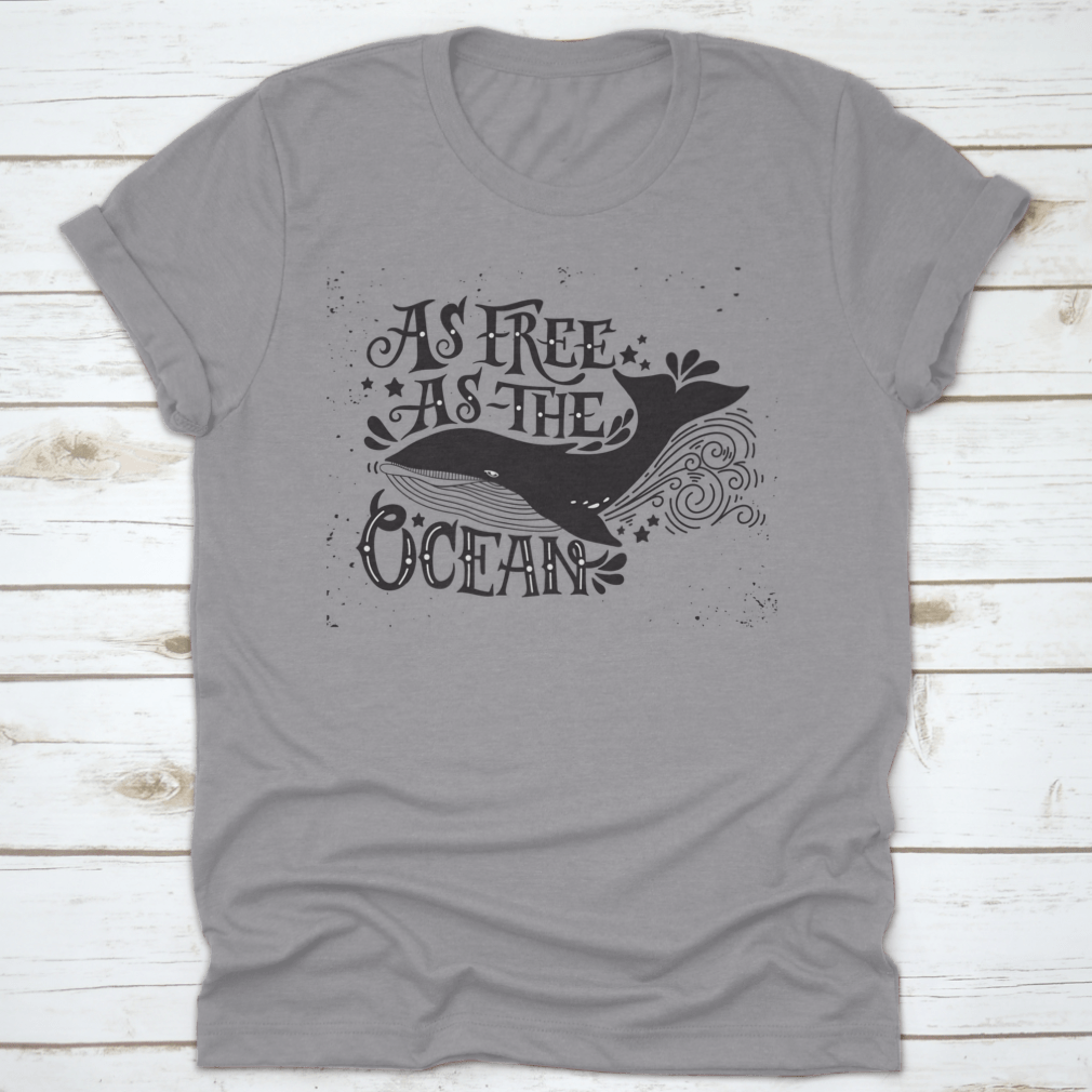 A stylish T-shirt featuring the quote 'As Free As The Ocean' designed for inspiration, made from soft cotton fabric.