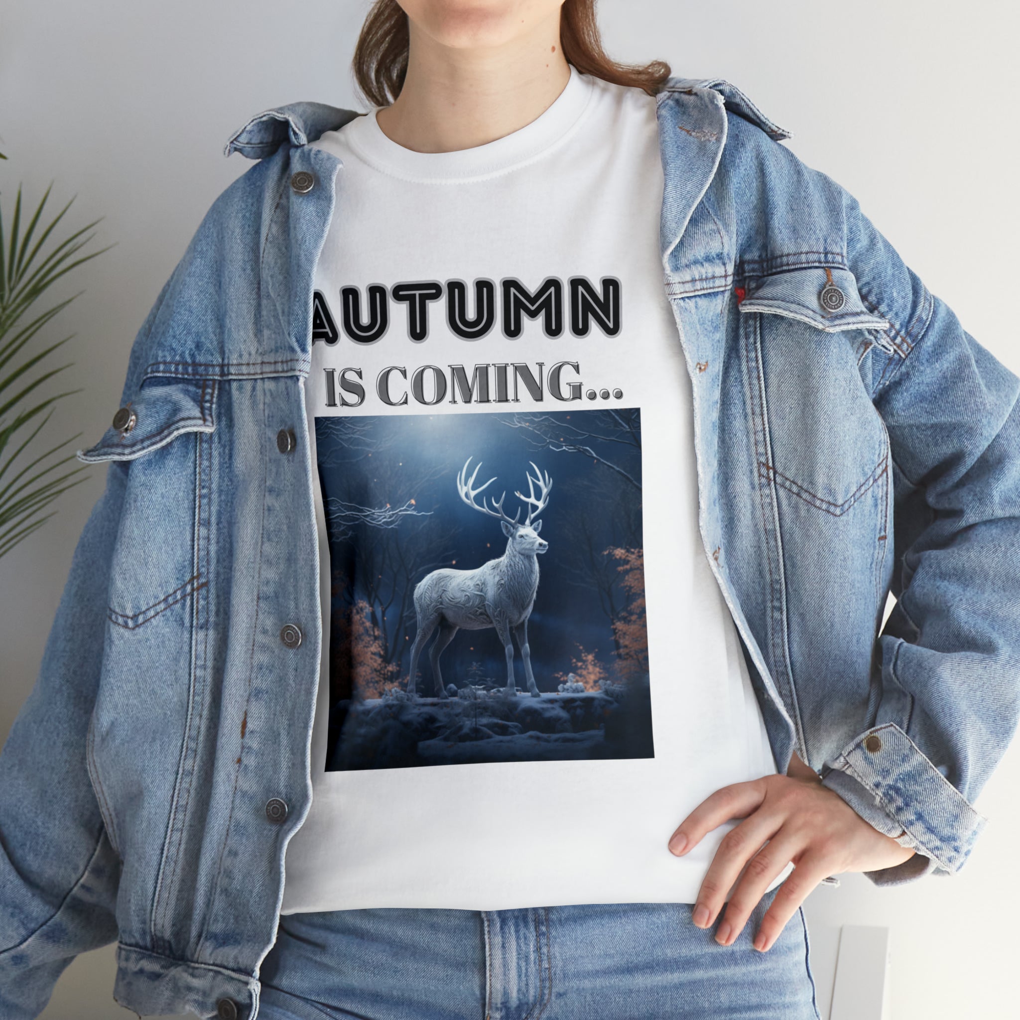 A stylish Fall Vibes T-shirt featuring a serene deer drinking from a brook surrounded by colorful autumn leaves.