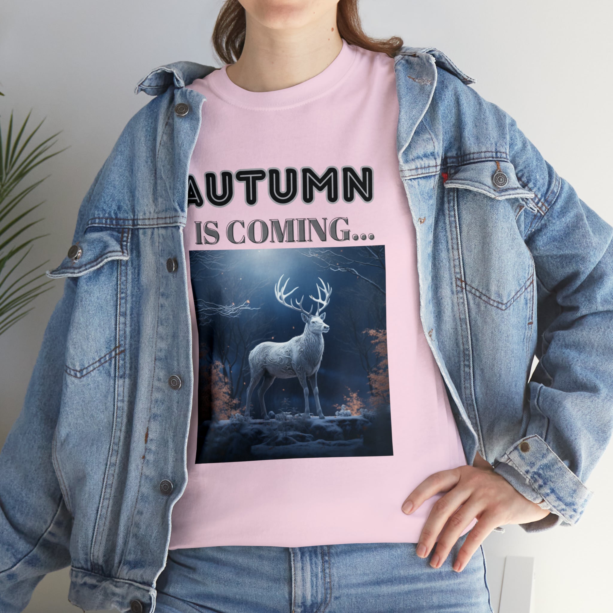 A stylish Fall Vibes T-shirt featuring a serene deer drinking from a brook surrounded by colorful autumn leaves.