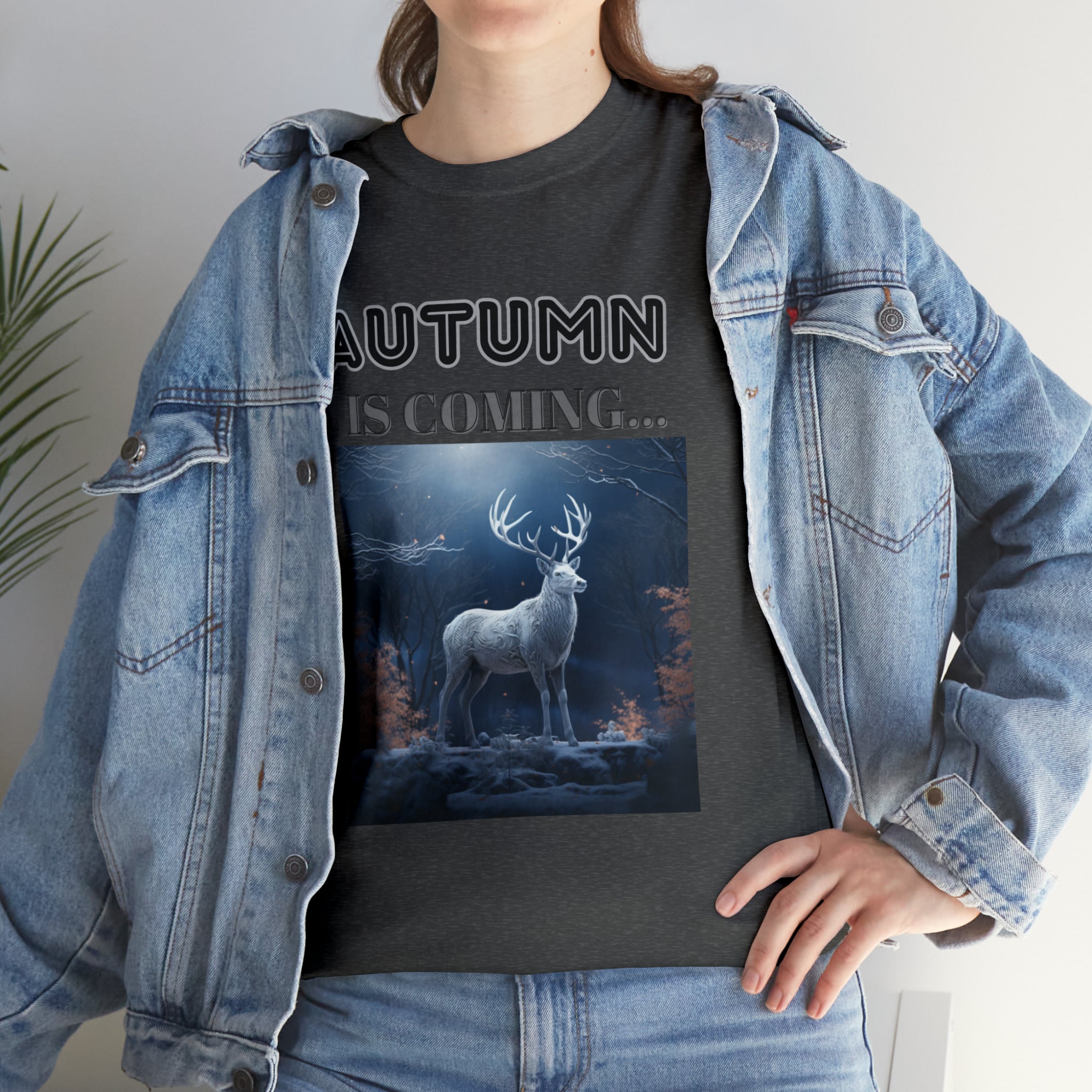 A stylish Fall Vibes T-shirt featuring a serene deer drinking from a brook surrounded by colorful autumn leaves.
