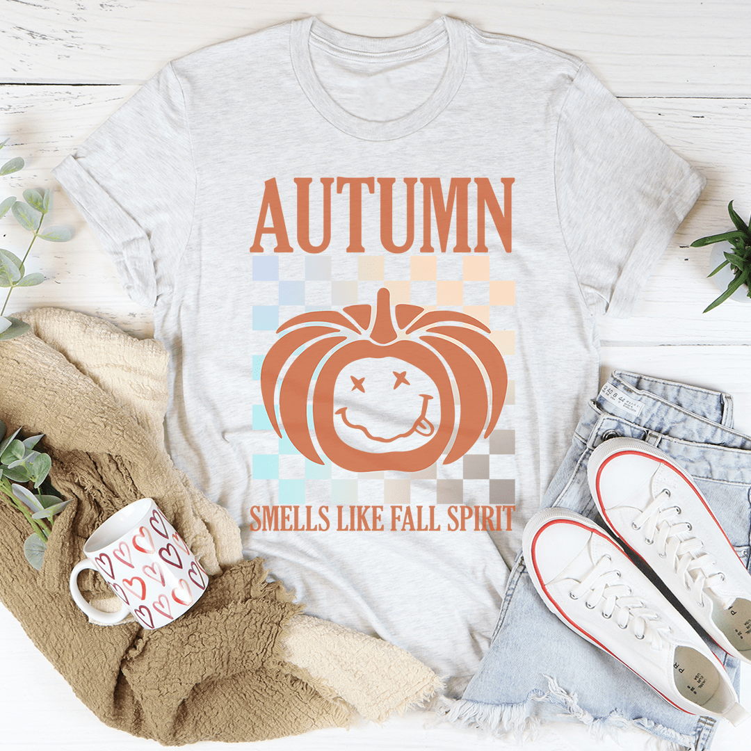 Autumn Smells Like Fall Spirit T-Shirt in a cozy setting, showcasing its soft fabric and vibrant print.