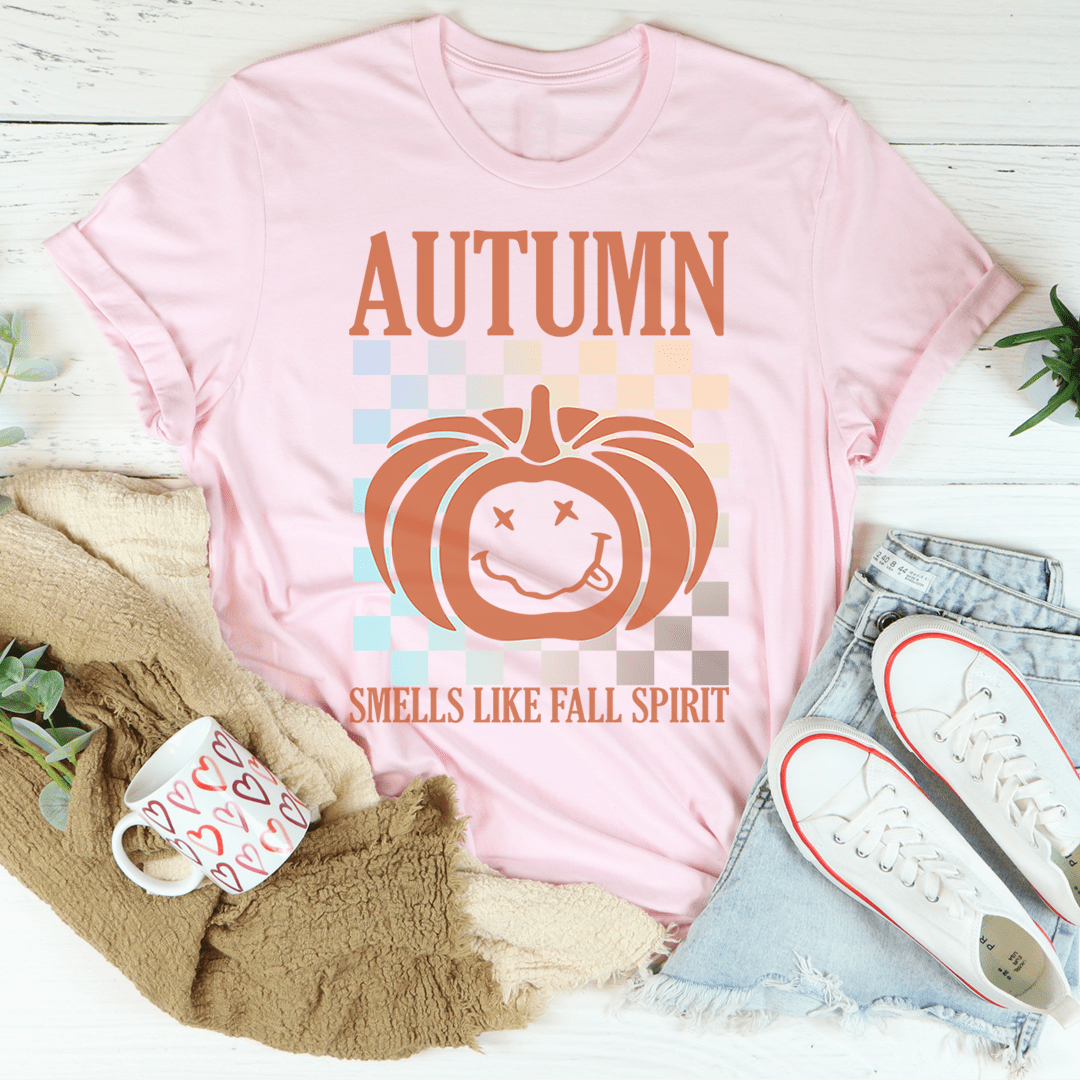 Autumn Smells Like Fall Spirit T-Shirt in a cozy setting, showcasing its soft fabric and vibrant print.
