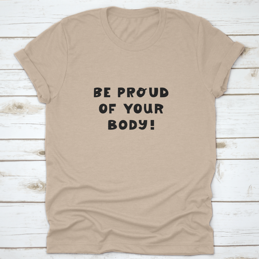 A white t-shirt featuring cute hand-drawn lettering that says 'Be Proud Of Your Body', showcasing a stylish and positive message.
