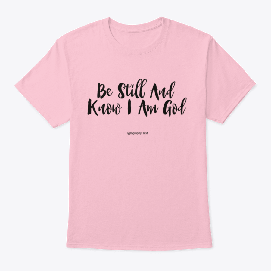 A comfortable T-shirt featuring the bold typography quote 'Be Still And Know I Am God', showcasing its inspirational design and quality fabric.