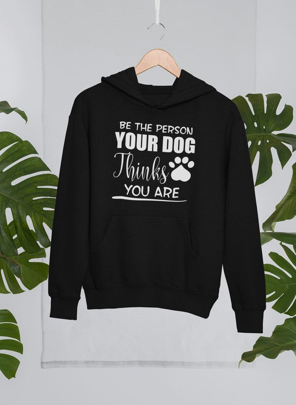 A cozy hoodie featuring the phrase 'Be The Person Your Dog Thinks You Are', designed for dog lovers with an adjustable hood and fleece lining.