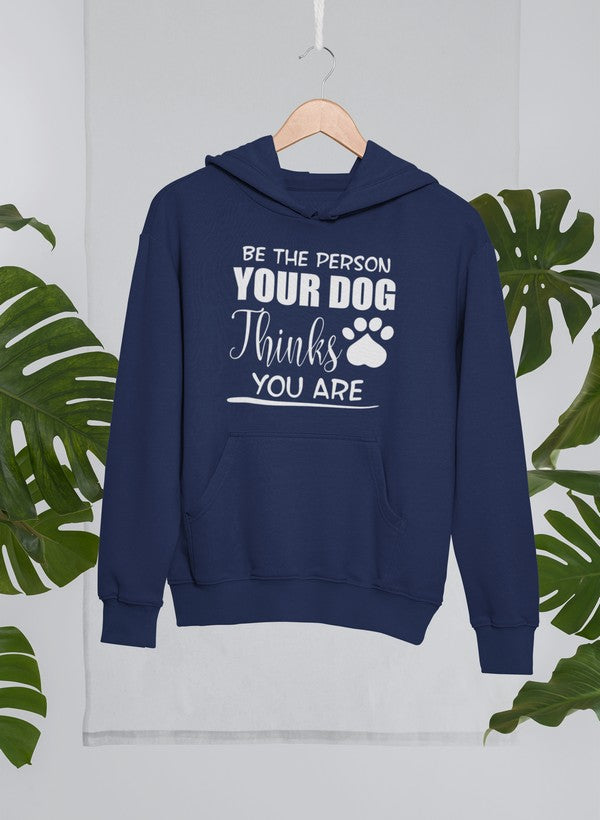 A cozy hoodie featuring the phrase 'Be The Person Your Dog Thinks You Are', designed for dog lovers with an adjustable hood and fleece lining.