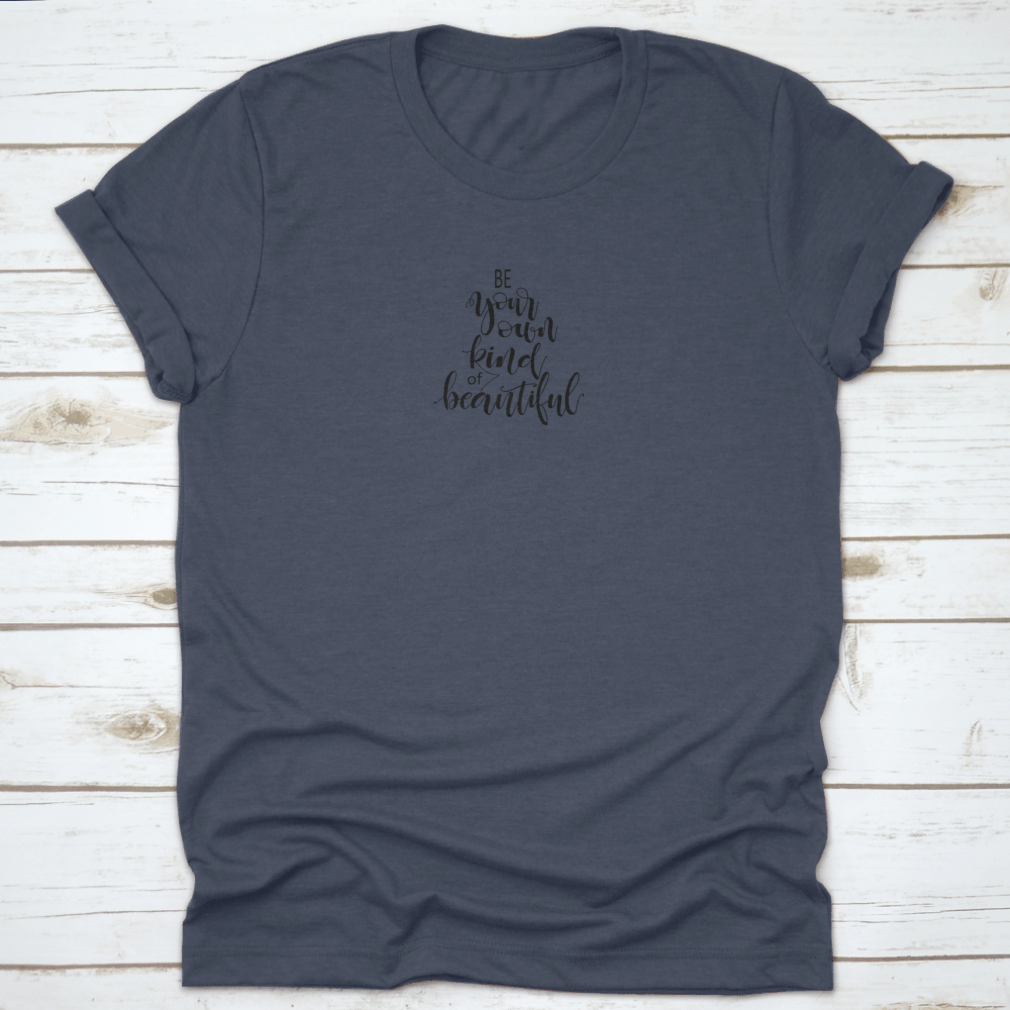 A stylish apparel featuring the handwritten phrase 'Be Your Own Kind Of Beautiful' in an inspirational design, made from soft cotton fabric.