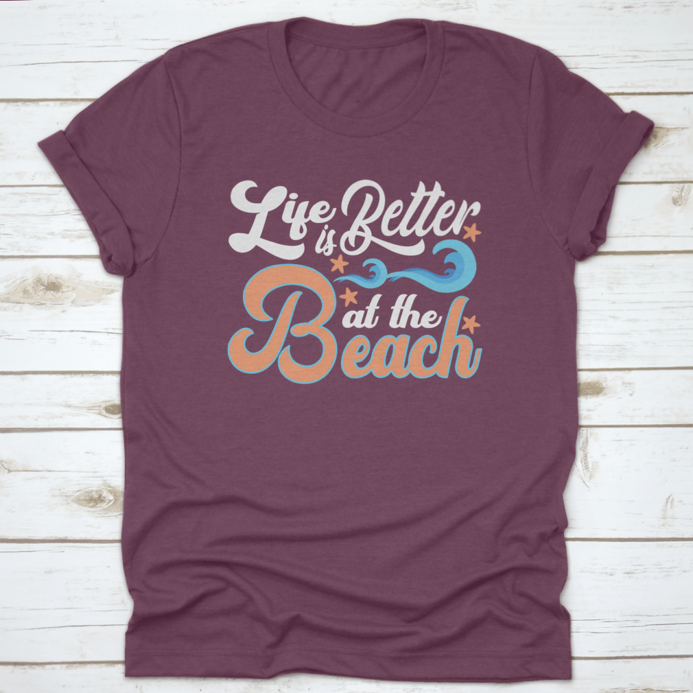 A comfortable cotton t-shirt featuring the slogan 'Life Is Better At The Beach', perfect for beach lovers.