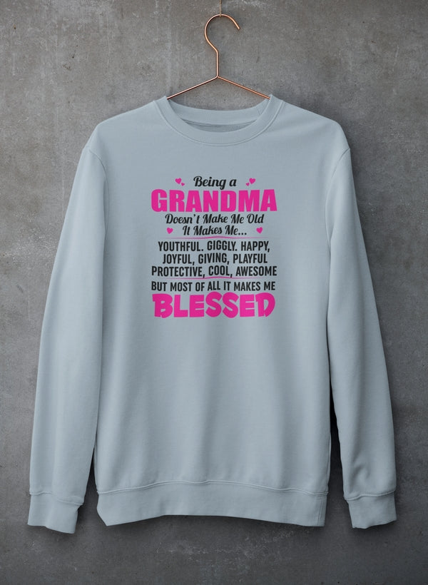 Cozy sweatshirt with the phrase 'Being A Grandma Doesn't Make Me Old' designed for stylish grandmas.