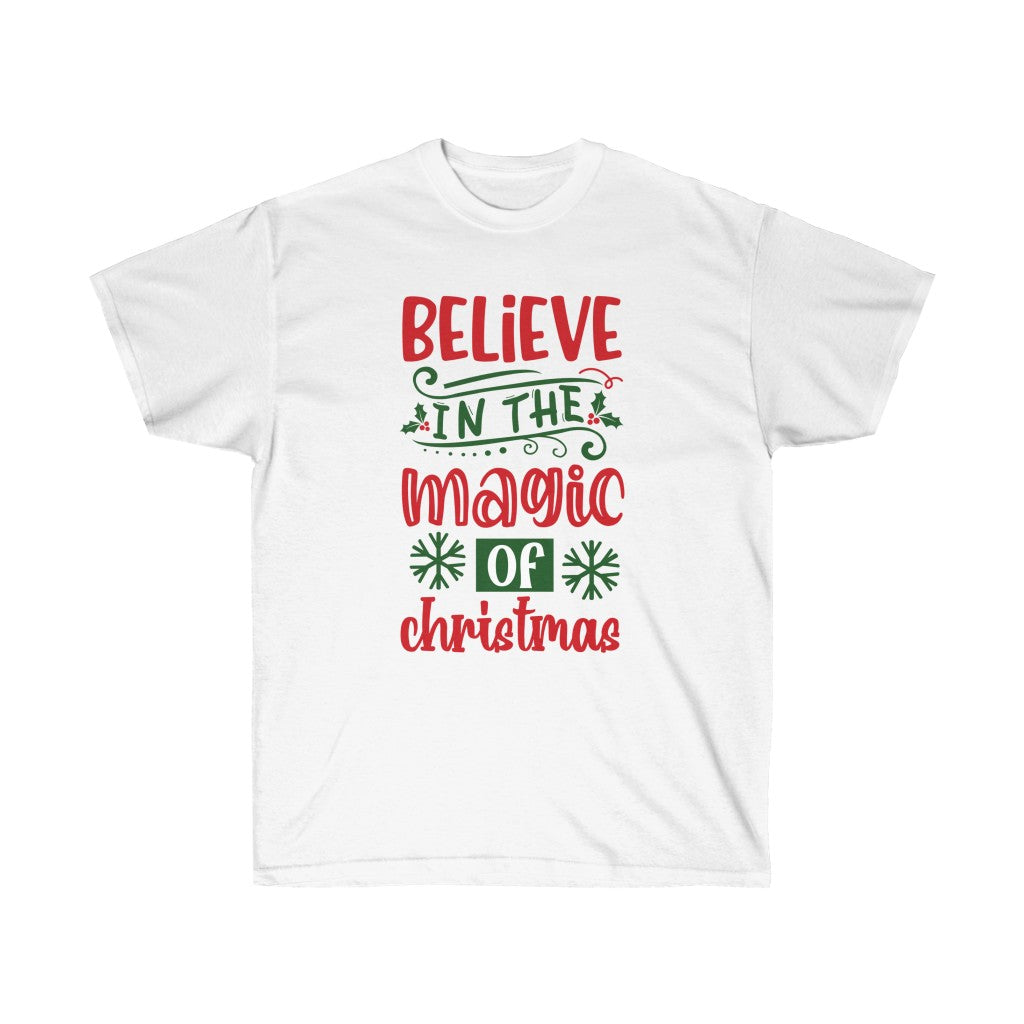 A festive holiday t-shirt featuring the phrase 'Believe in the Magic of Christmas' printed in vibrant colors on a soft cotton fabric.