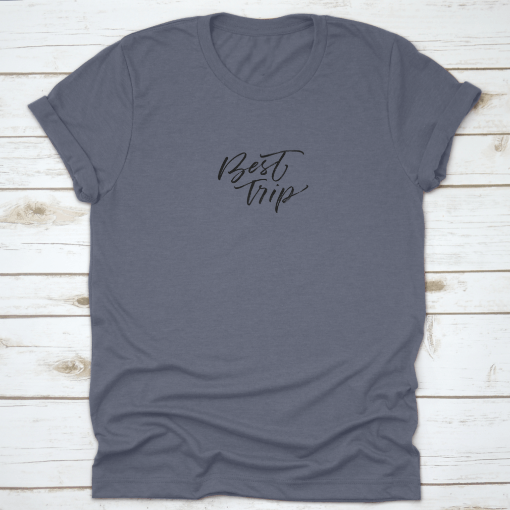 A stylish cotton t-shirt featuring modern brush ink illustration of 'Best Trip Adventure Lettering', perfect for casual wear.