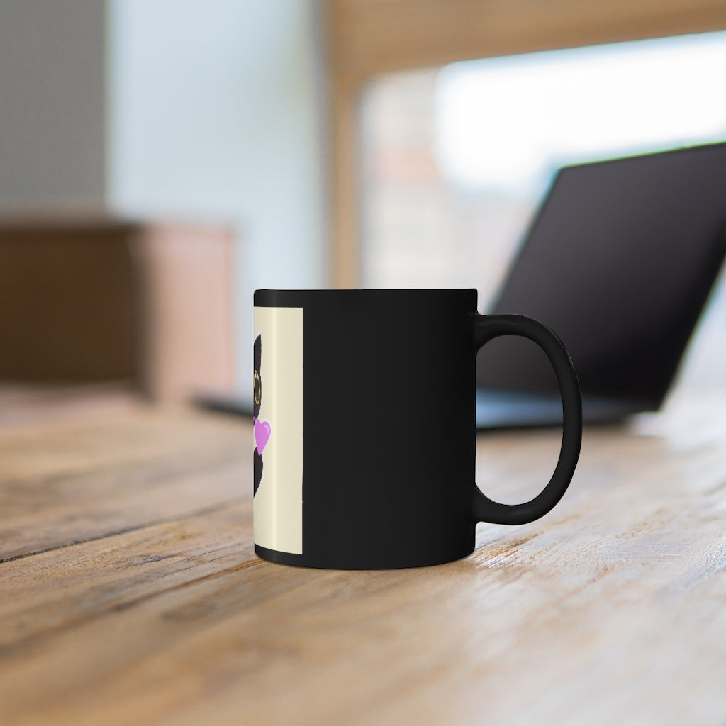 A stylish 11oz black ceramic mug with rounded corners and a C-handle, featuring a full-wrap decoration design.