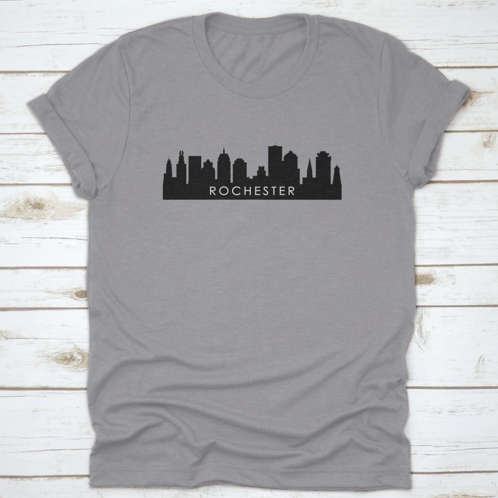 Black outline design of Rochester's city skyline on a cotton t-shirt, showcasing iconic landmarks.
