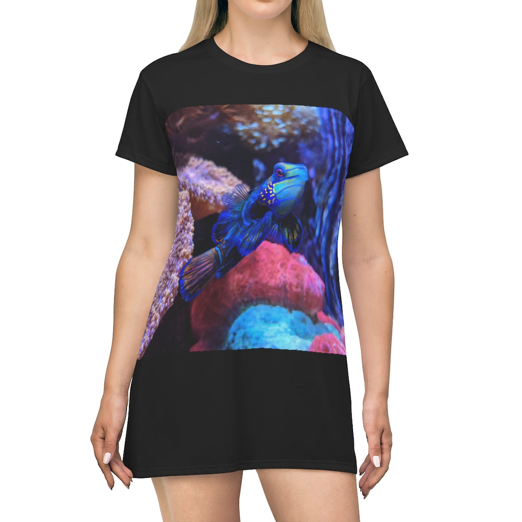 A vibrant Blue Fish All Over Print T-Shirt Dress showcasing a playful fish pattern on a lightweight fabric.