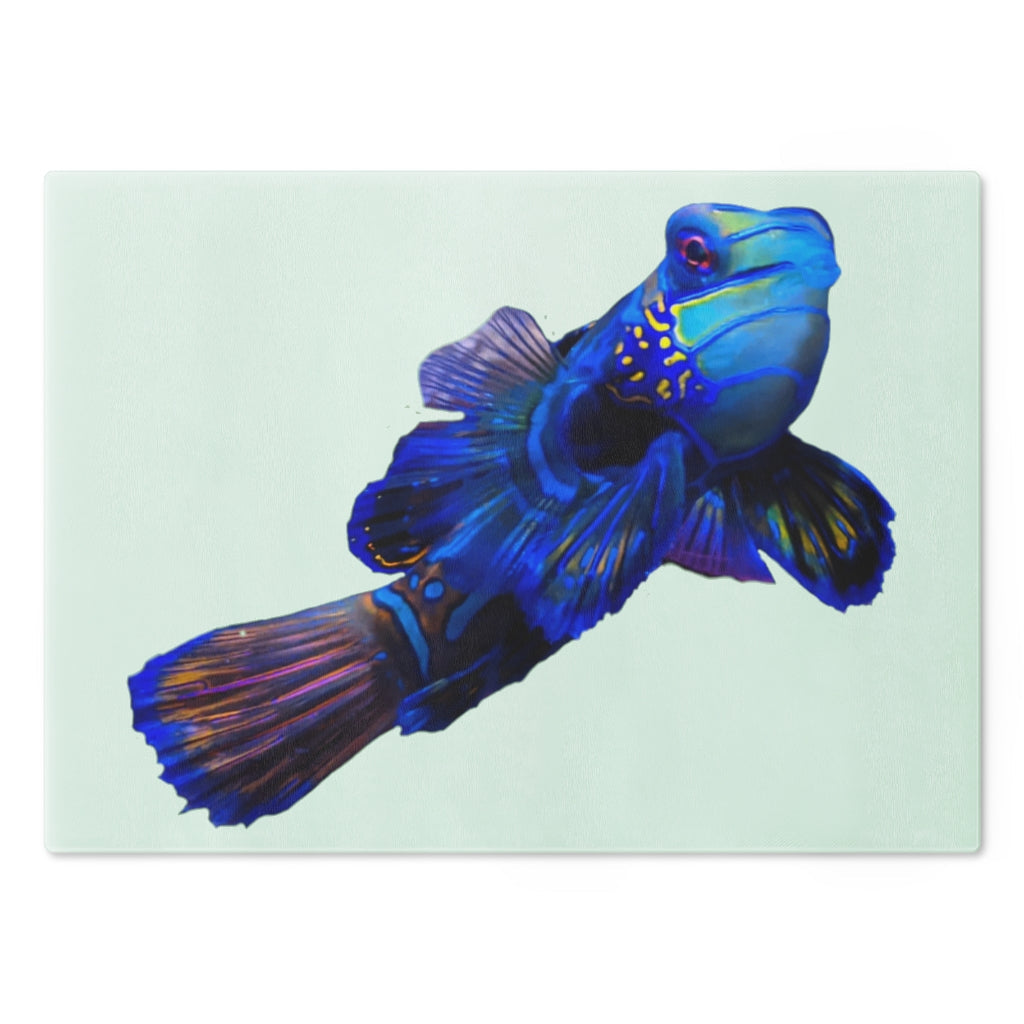 A stylish Blue Fish Cutting Board made of tempered glass, featuring a unique fish design and rubber dots for stability.