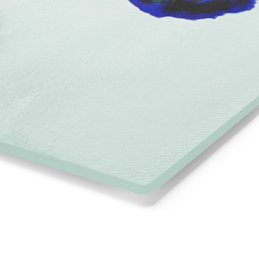 A stylish Blue Fish Cutting Board made of tempered glass, featuring a unique fish design and rubber dots for stability.