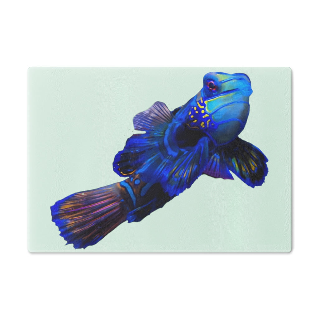 A stylish Blue Fish Cutting Board made of tempered glass, featuring a unique fish design and rubber dots for stability.