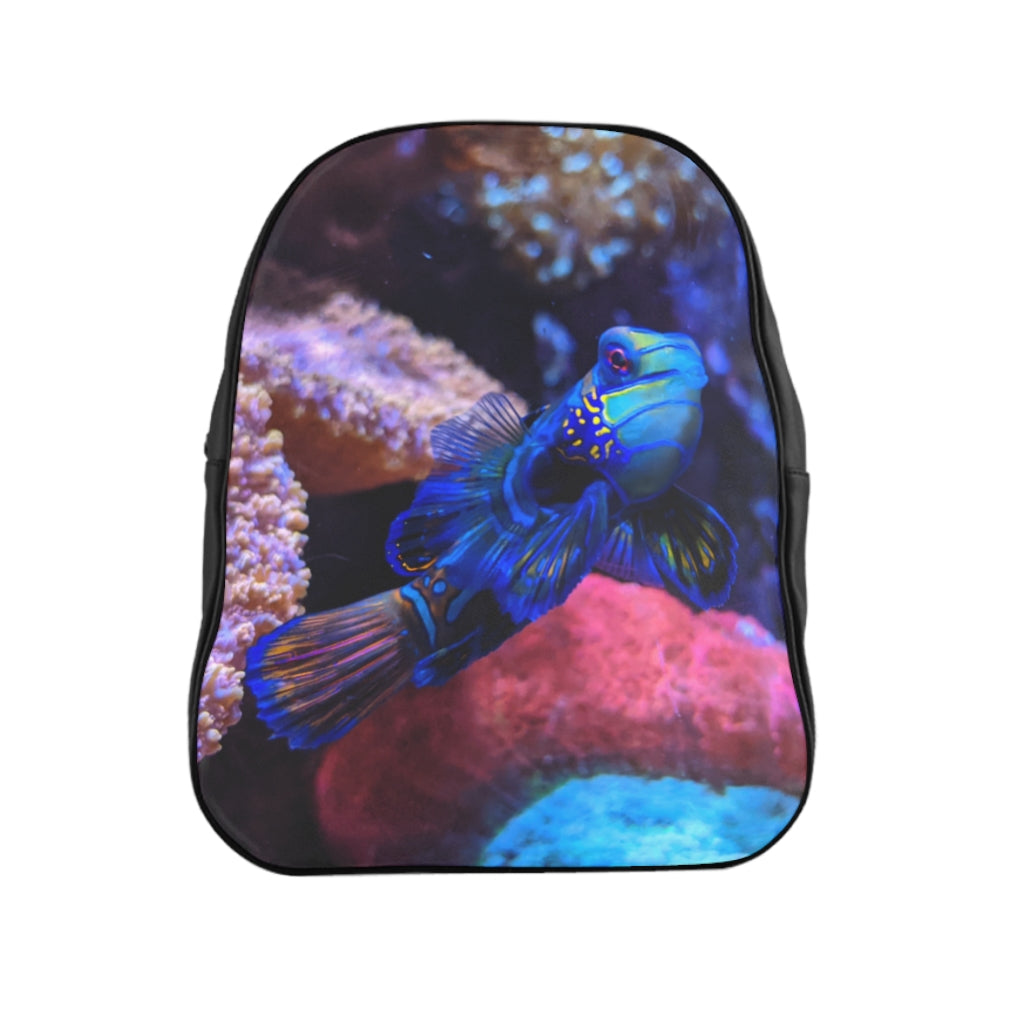 Blue Fish School Backpack featuring a vibrant fish print, padded back support, and spacious inside pockets, ideal for school and everyday use.