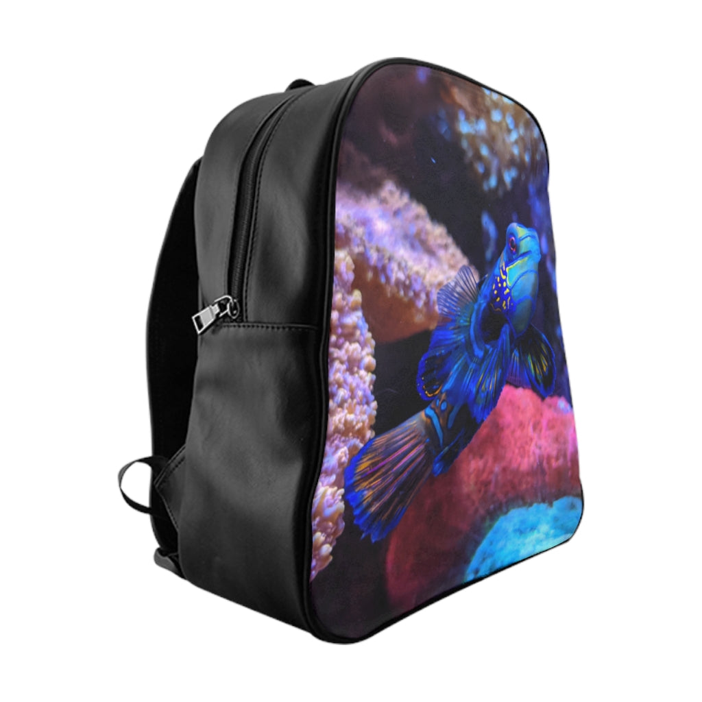 Blue Fish School Backpack featuring a vibrant fish print, padded back support, and spacious inside pockets, ideal for school and everyday use.