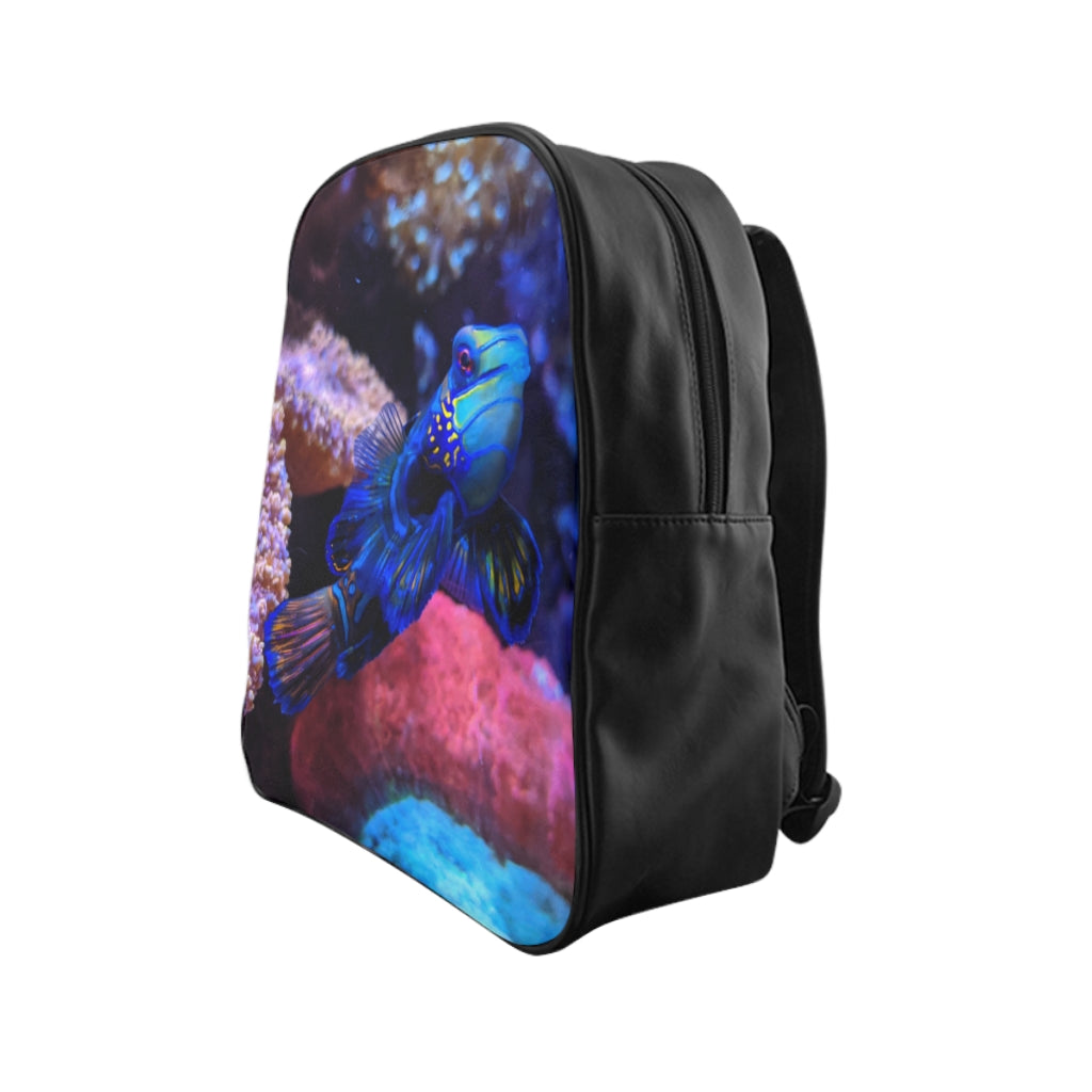Blue Fish School Backpack featuring a vibrant fish print, padded back support, and spacious inside pockets, ideal for school and everyday use.