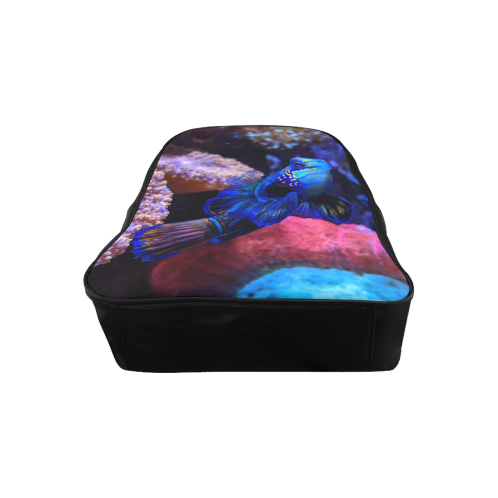 Blue Fish School Backpack featuring a vibrant fish print, padded back support, and spacious inside pockets, ideal for school and everyday use.