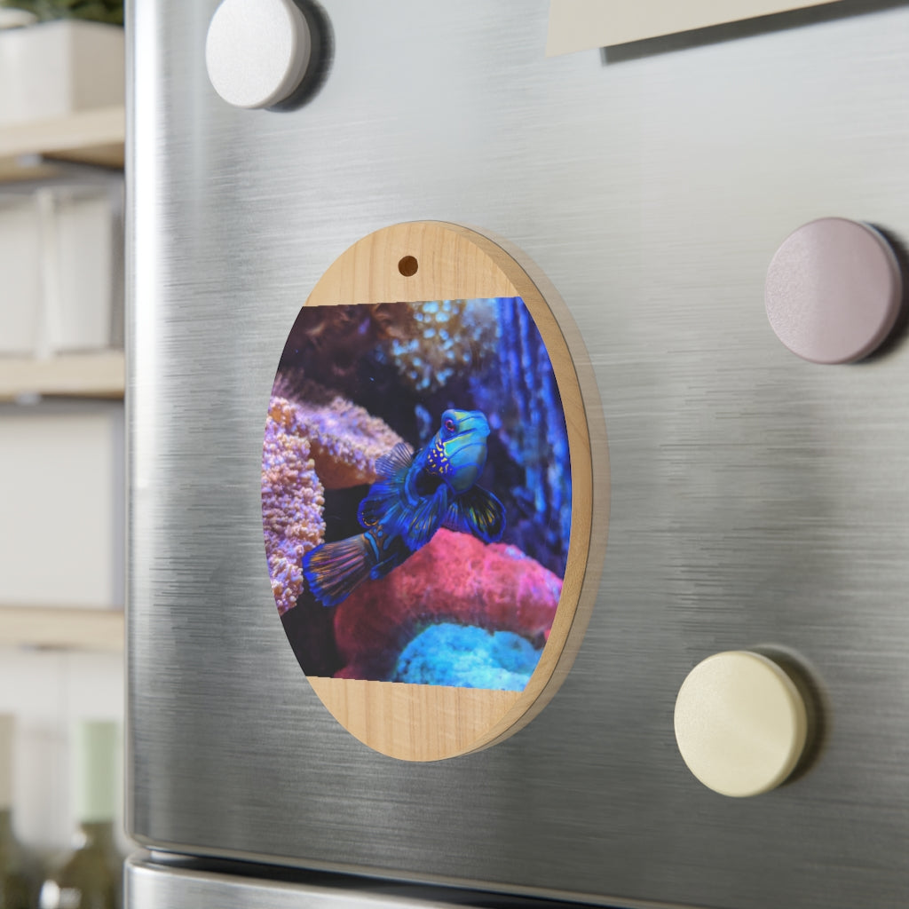 A collection of Blue Fish Wooden Christmas Ornaments in various whimsical shapes, featuring a rustic wood finish and red ribbons for hanging.