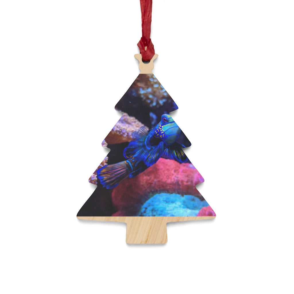 A collection of Blue Fish Wooden Christmas Ornaments in various whimsical shapes, featuring a rustic wood finish and red ribbons for hanging.