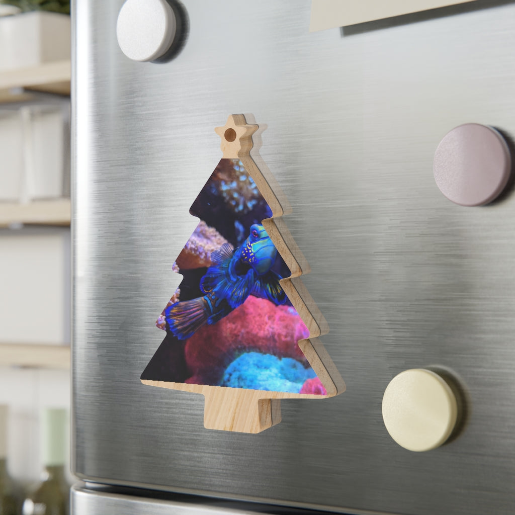 A collection of Blue Fish Wooden Christmas Ornaments in various whimsical shapes, featuring a rustic wood finish and red ribbons for hanging.