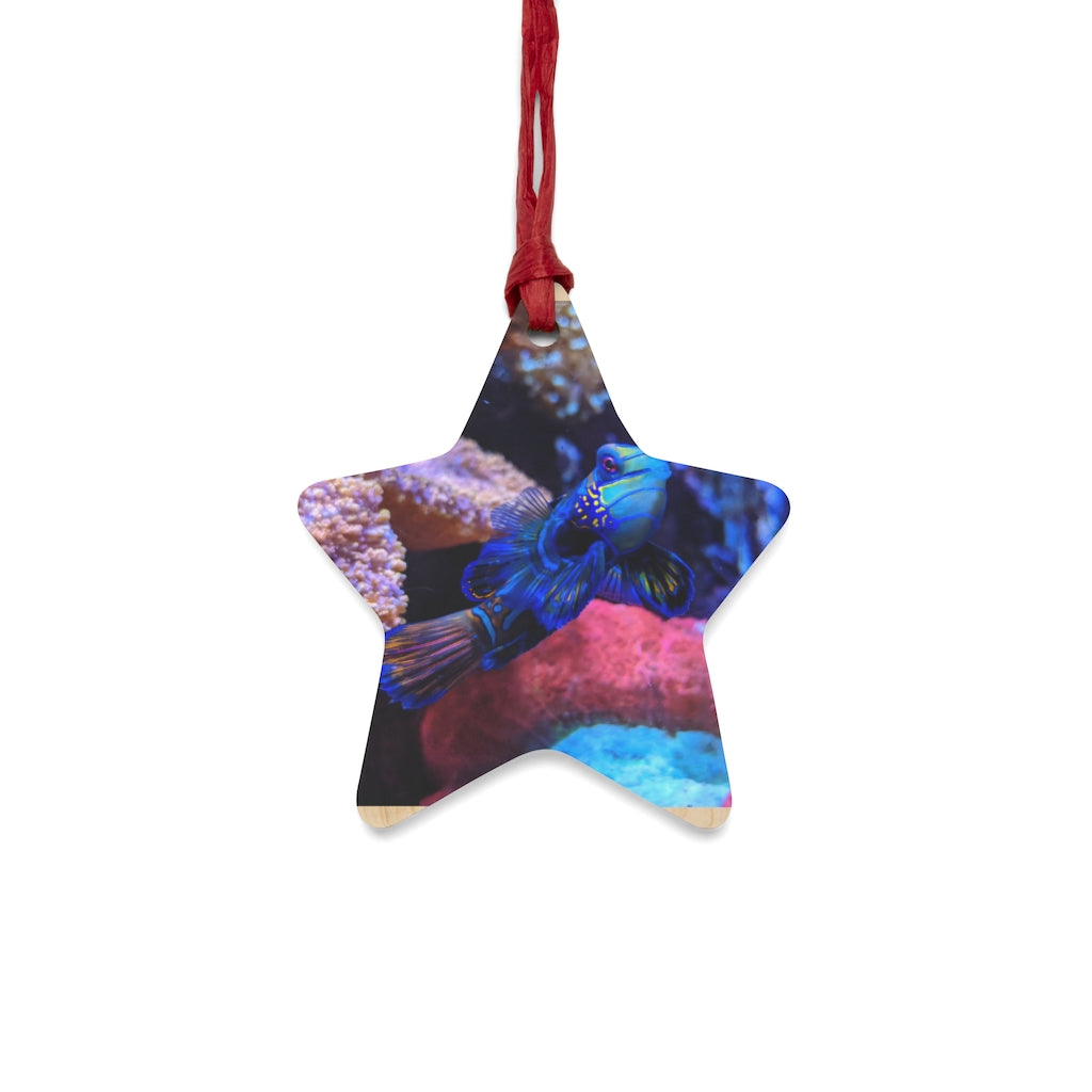 A collection of Blue Fish Wooden Christmas Ornaments in various whimsical shapes, featuring a rustic wood finish and red ribbons for hanging.