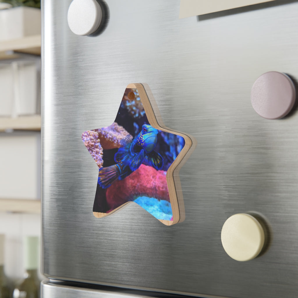 A collection of Blue Fish Wooden Christmas Ornaments in various whimsical shapes, featuring a rustic wood finish and red ribbons for hanging.