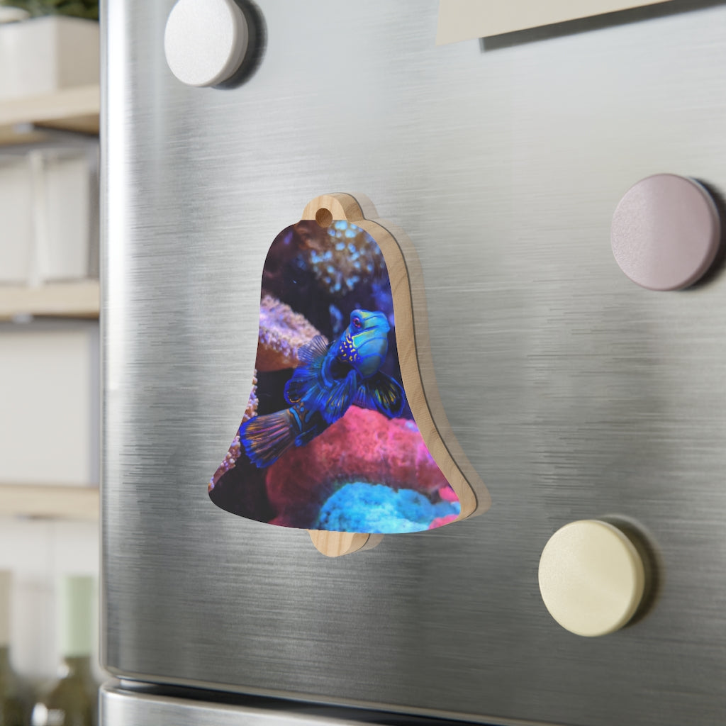 A collection of Blue Fish Wooden Christmas Ornaments in various whimsical shapes, featuring a rustic wood finish and red ribbons for hanging.